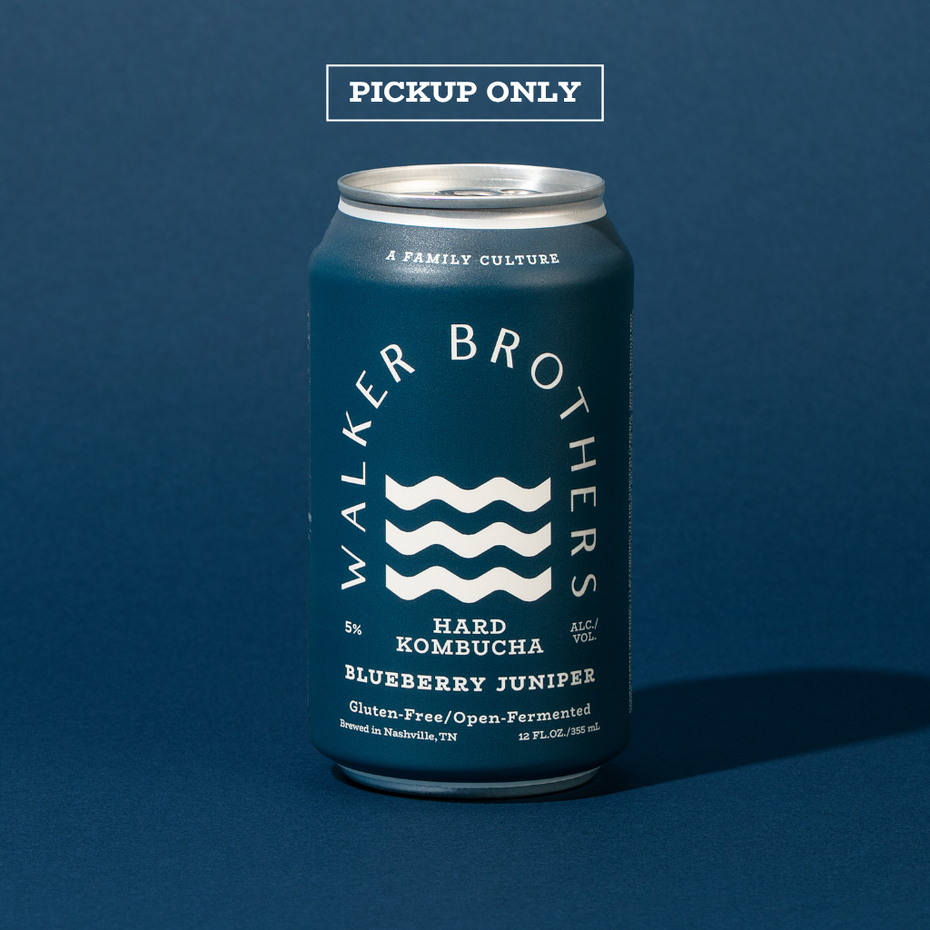 A dark blue can of Walker Brothers Blueberry Juniper Hard Kombucha sits against a blue background. Text above the can says Pickup Only to indicate this item is only available for pickup at the Walker Brothers brewery